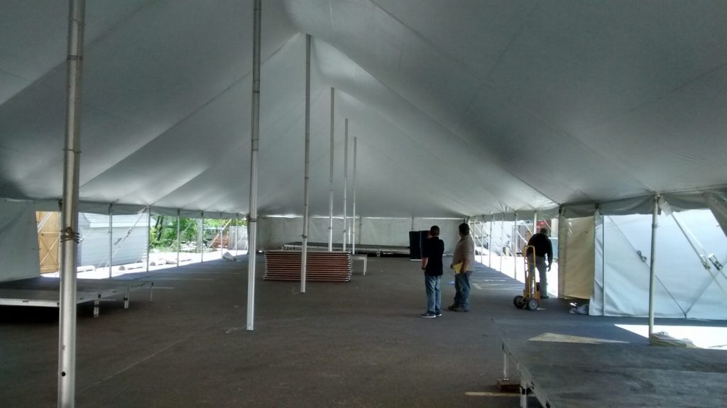 Under 40' x 140' rope and pole tent at restaurant for Cinco de Mayo event