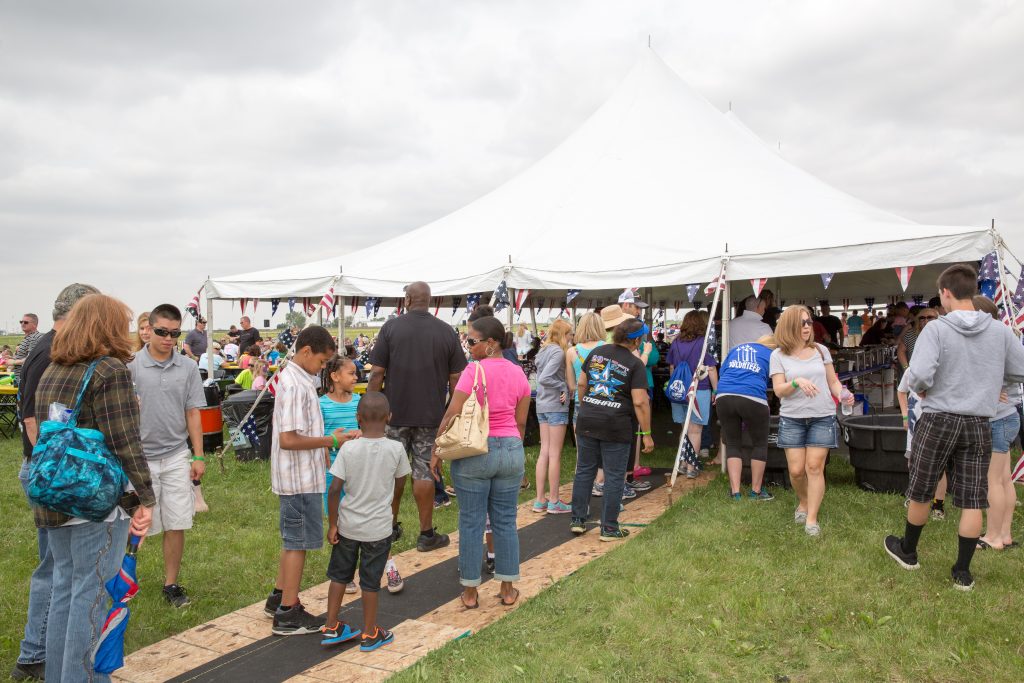 Crowd waiting in line by tent at Quad City Airshow QCAS 2015