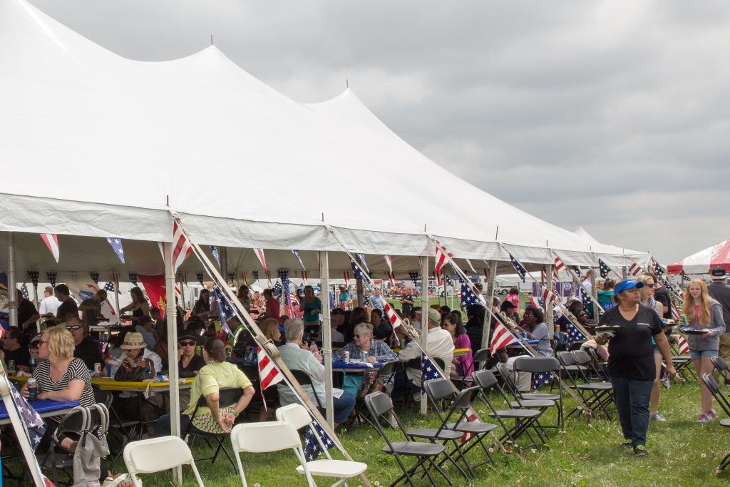 People eating under tent at Quad City Airshow QCAS 2015