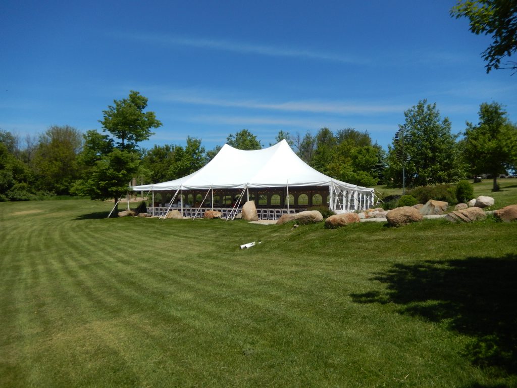Wide view of open side of wedding tent at Harvest Preserve