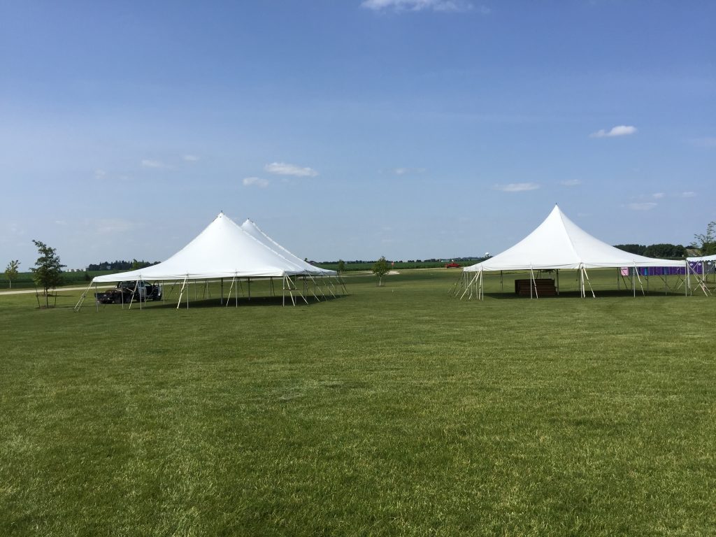 Setting up tents for outdoor festival in Iowa