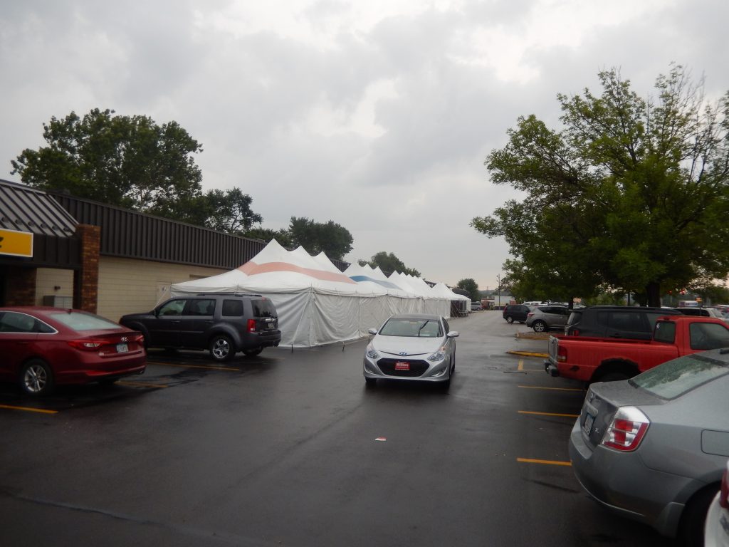 Started to rain after setting up tents at the Paul's Sidewalk Clearance sale
