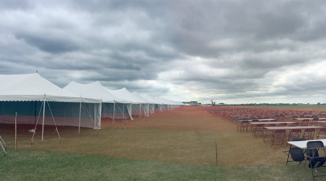 Total of twenty-two 20' x 30' rope and pole tents in a row!