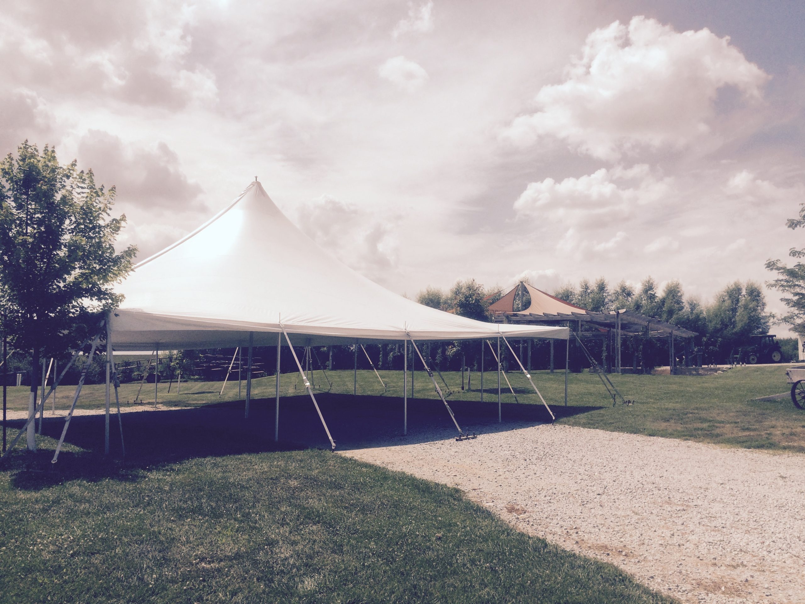 View of rope and pole tent at Sutliff Cider Company for 2015 RAGBRAI