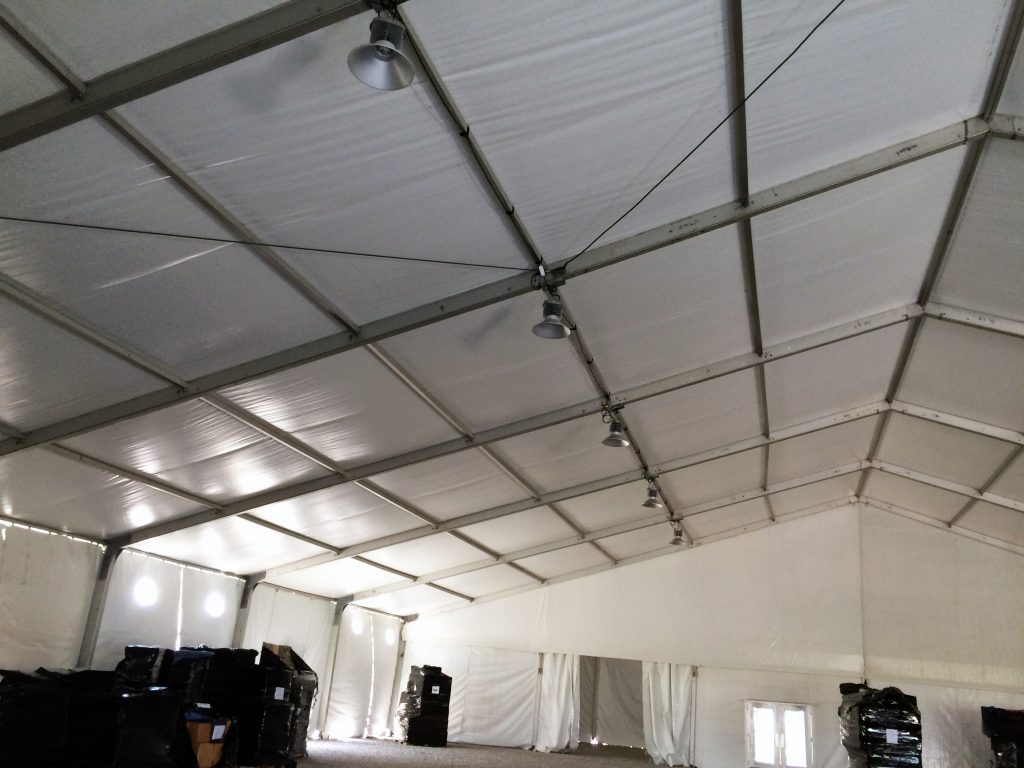 High-bay lighting under 100' x 131' clear span tent