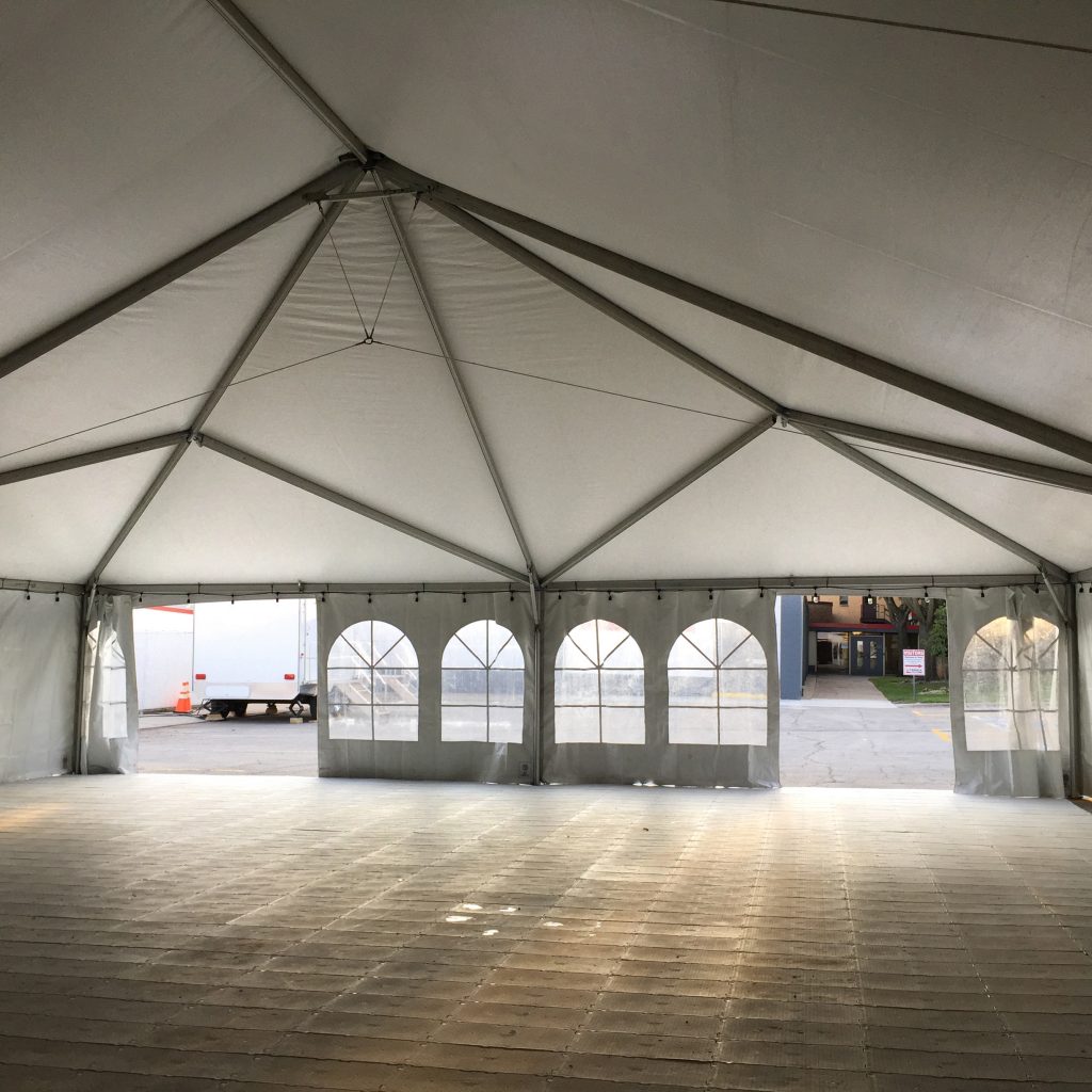 Inside 40' x 80' hybrid with subflooring tent at corporate event in Waverly, Iowa