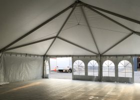 Inside 40′ x 80′ hybrid with subflooring tent at corporate event in Waverly, Iowa