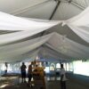 Installation of sheer drape under 40' x 80' Hybrid wedding tent