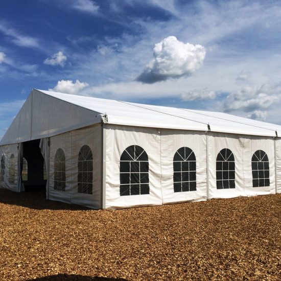 Outside view of 50' x 50' clear span tent with french window side wall