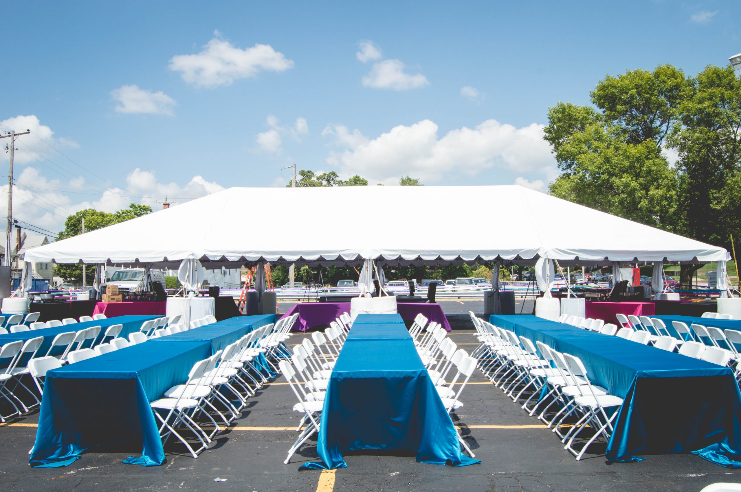 Tent with banquet tables and lennons at the Homecoming Festival at Palmer College of Chiropractic