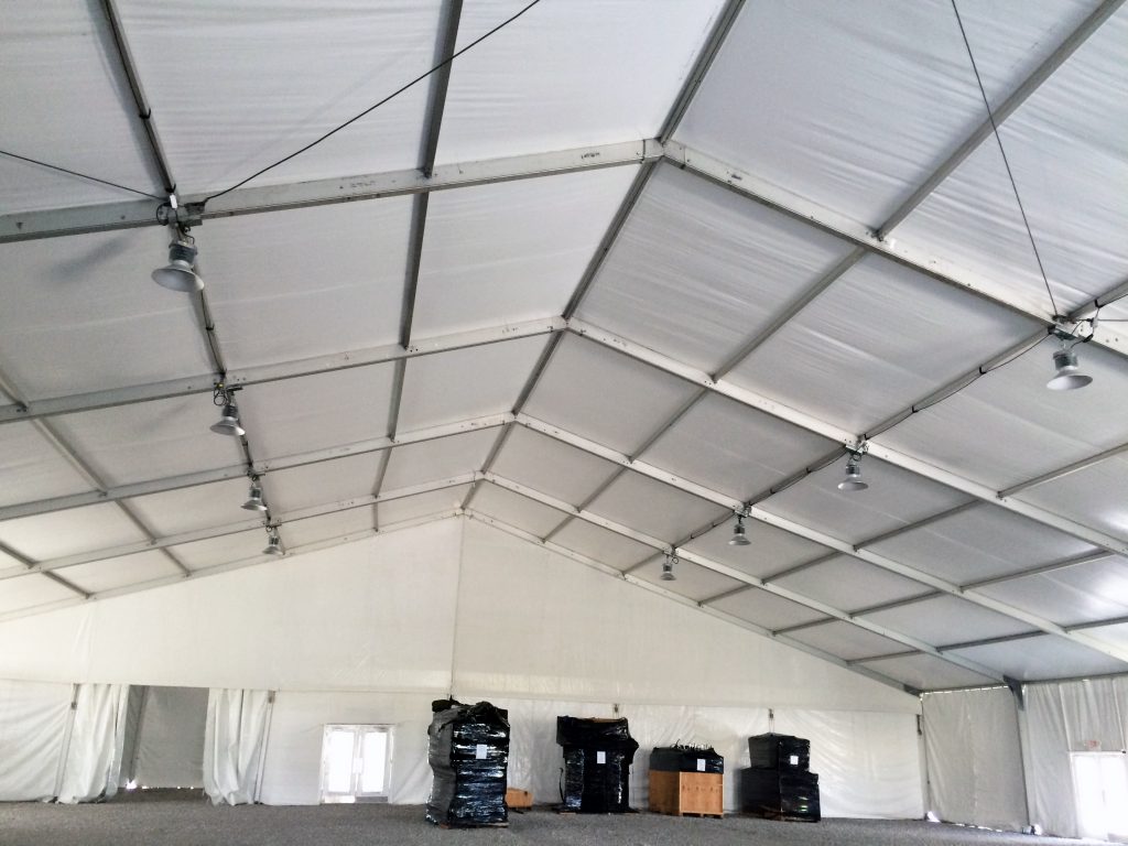 Two rows of high-bay lighting under 100' x 131' clear span tent