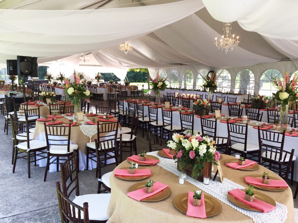Wedding reception tent with sheer drape tables and chairs