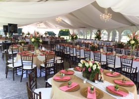 Wedding reception tent with sheer drape tables and chairs