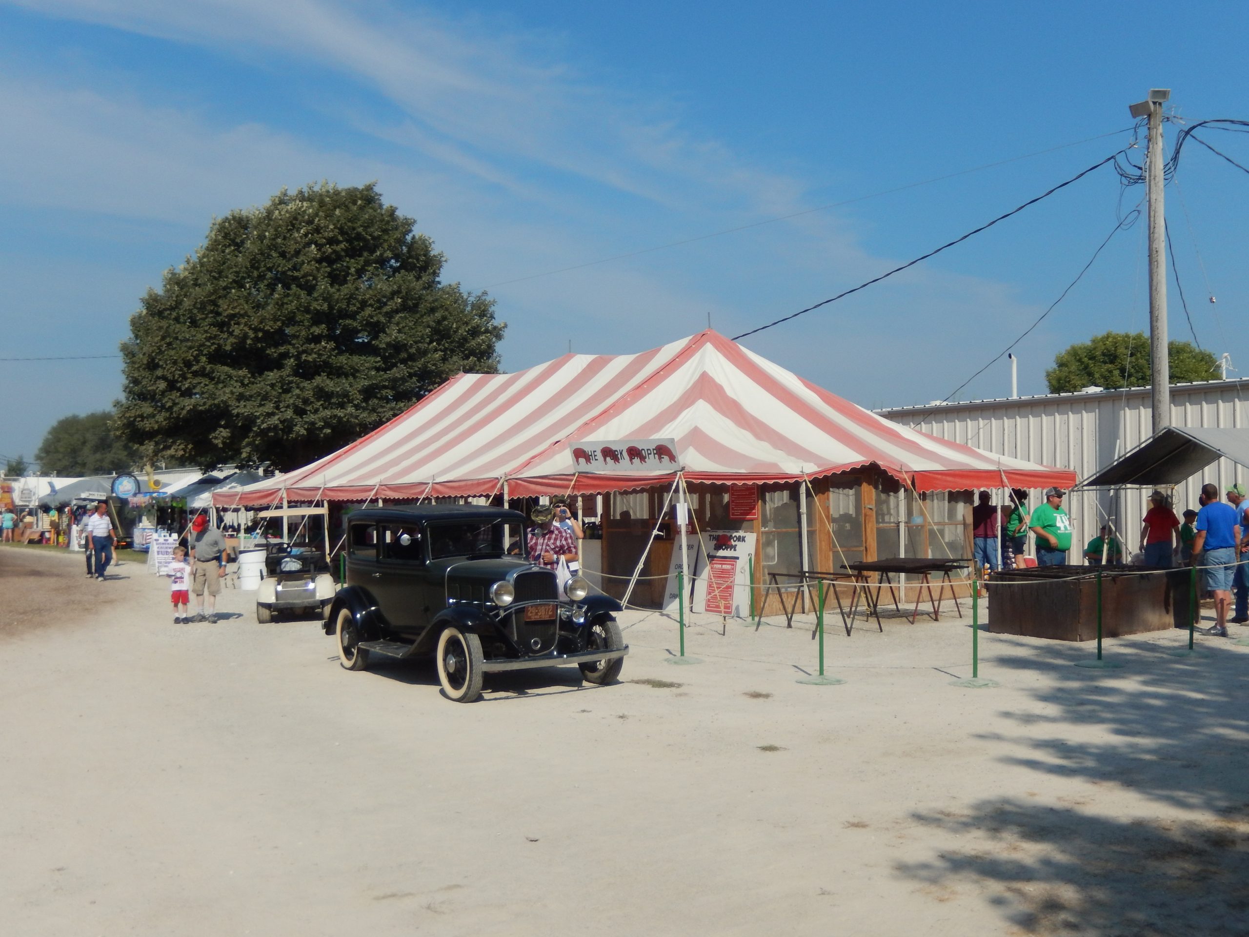 30′ x 60′ Red & white (rope and pole) tent used for food service