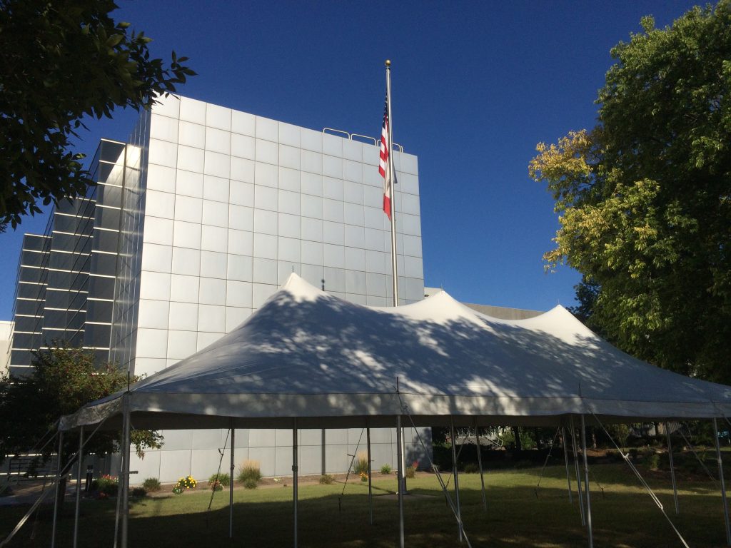 20' x 40' rope an pole tent with Alcoa building in background in Bettendorf, Iowa