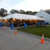 20' x 50' frame tent with tables, lights, linens and chairs