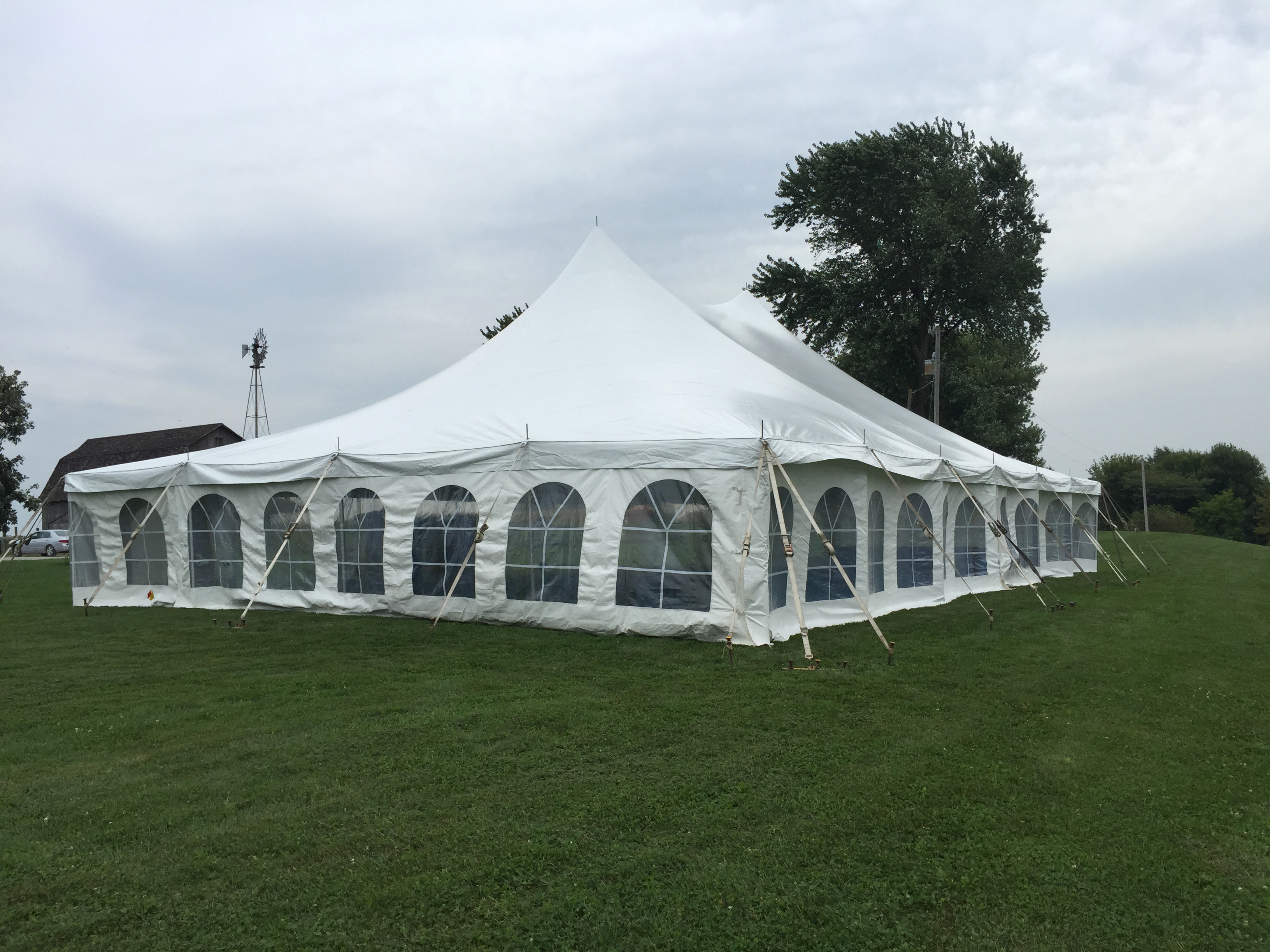 Backyard wedding reception under a tent in Kalona, Iowa