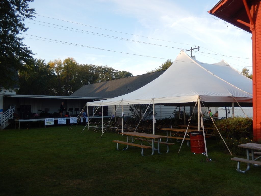 40' x 60' rope and pole tent for seating to watch concert at Fall Festival