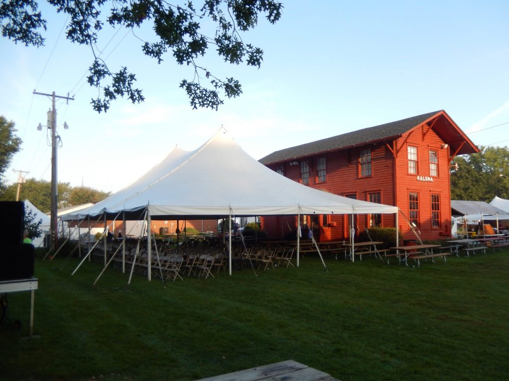 40' x 60' rope and pole tent for seating to watch concert at Fall Festival