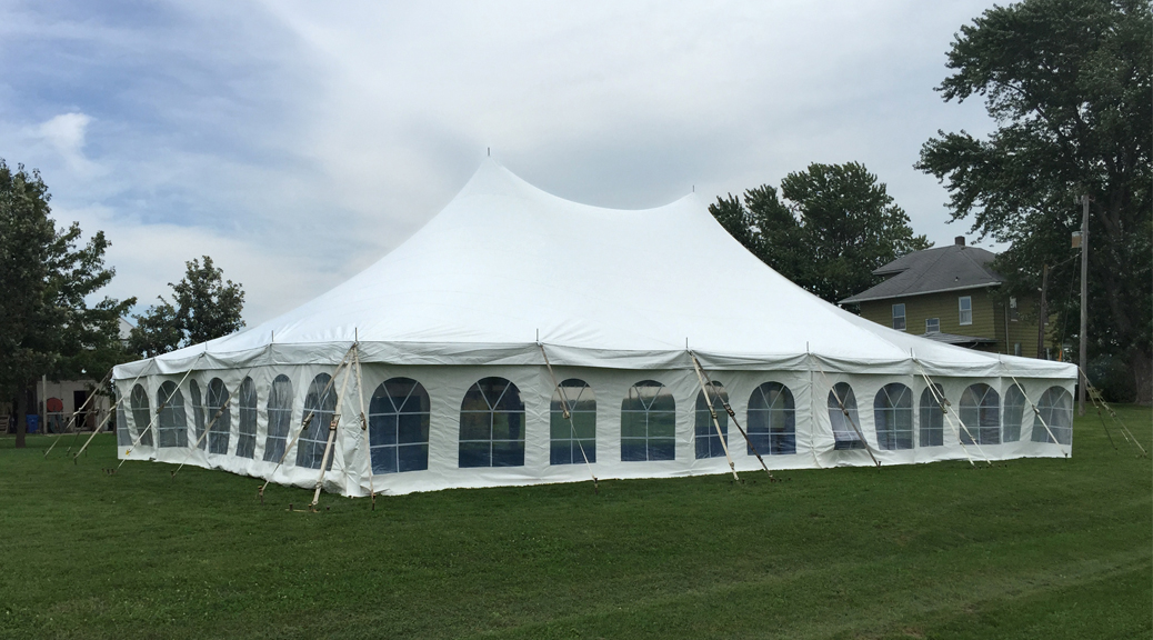 Backyard wedding reception under a tent in Kalona, Iowa