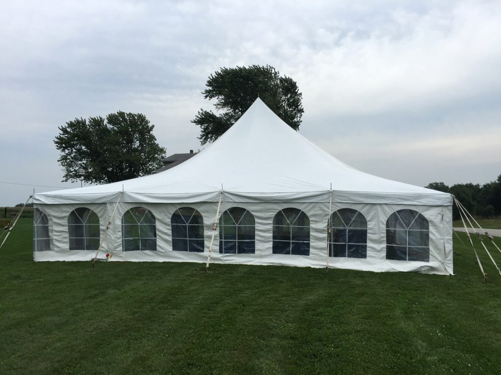 End view of backyard wedding reception tent