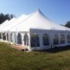 Outside of 40' x 100' rope and pole wedding tent with French window sidewall