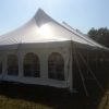Outside of 40' x 100' rope and pole wedding tent with sidewall