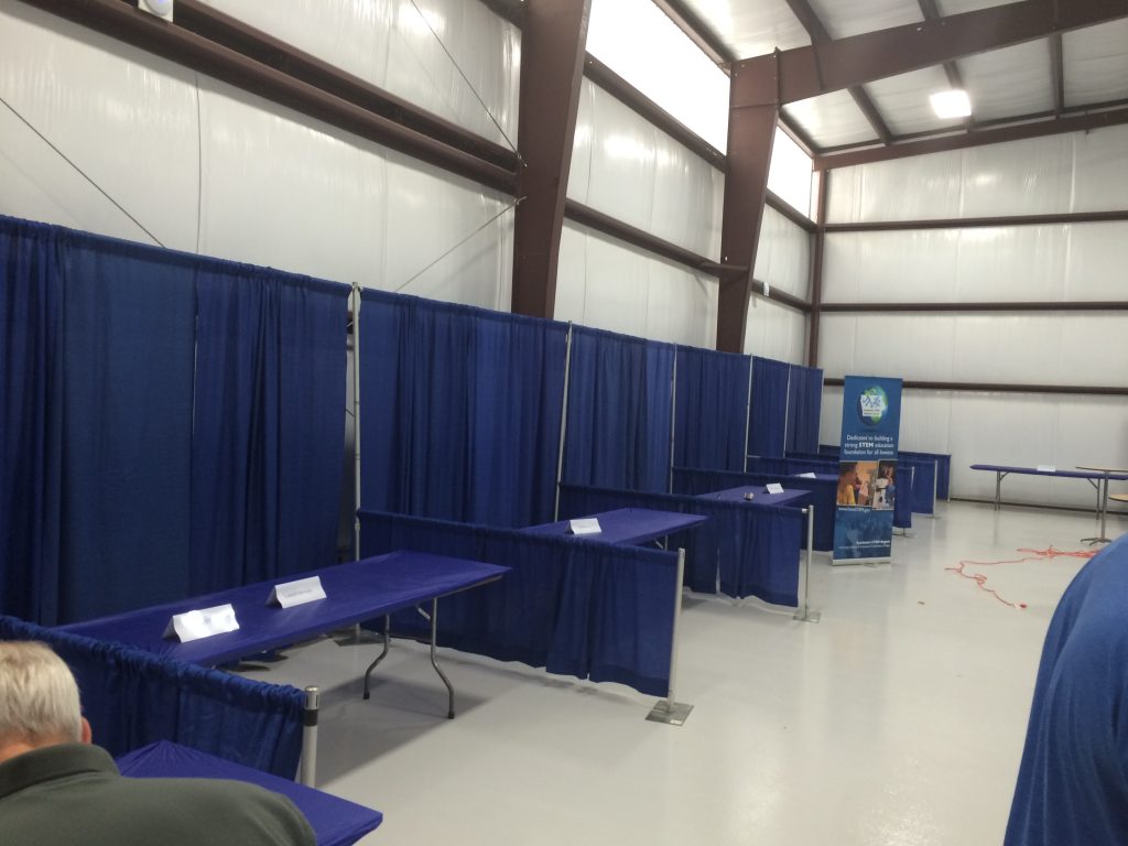 Pipe and drape booths at Iowa City Area Development Group event
