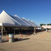 Side of 40' x 120' rope and pole tent with tent in the background