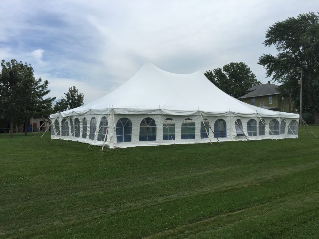 Backyard wedding reception under a tent