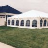 Home with 30' x 60' frame tent in side yard for wedding reception in Dubuque, Iowa