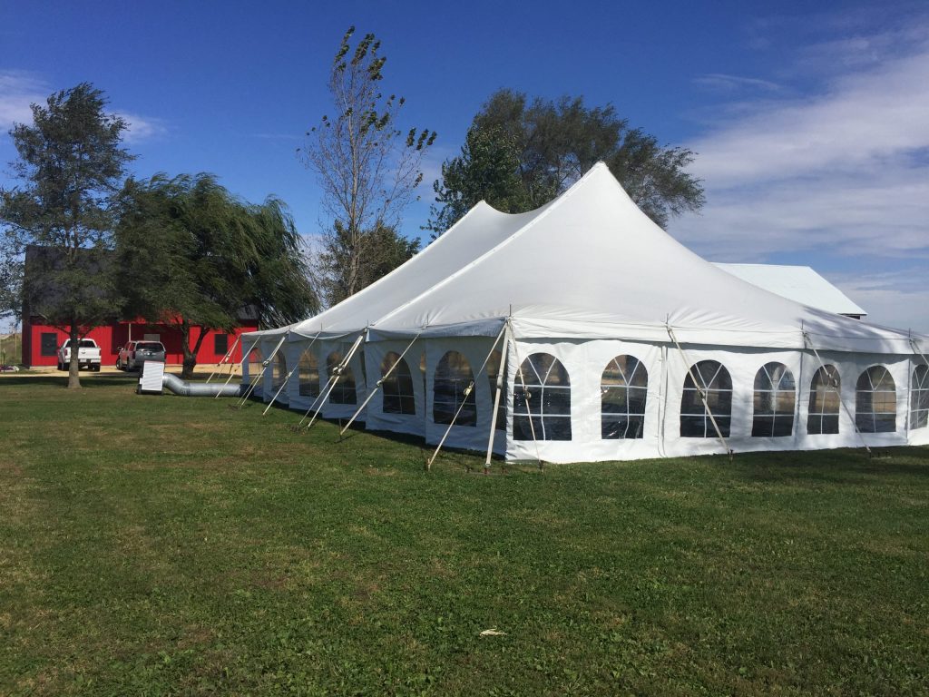 Outside of 40' x 60' rope and pole wedding tent with sidewall in De Witt, Iowa