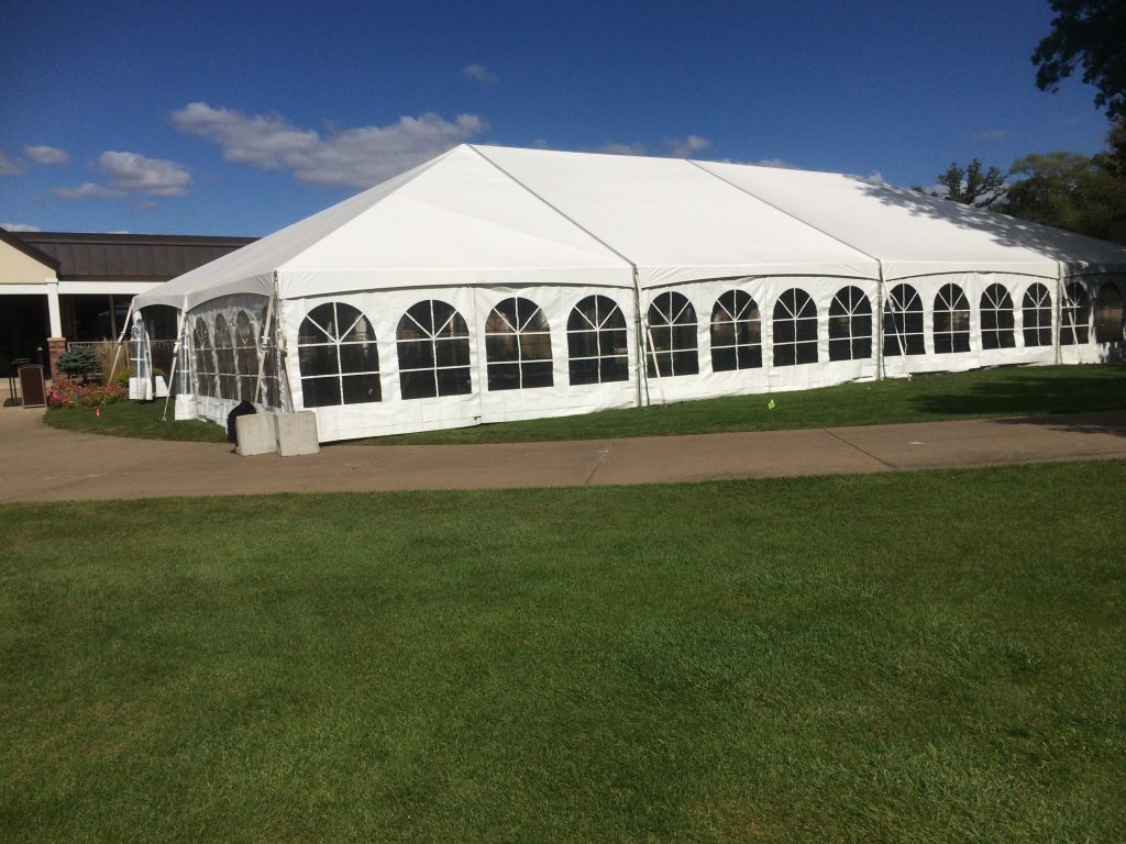 Side of 40' x 80' wedding reception tent at Oakwood Country Club in Coal Valley Illinois outside of tent