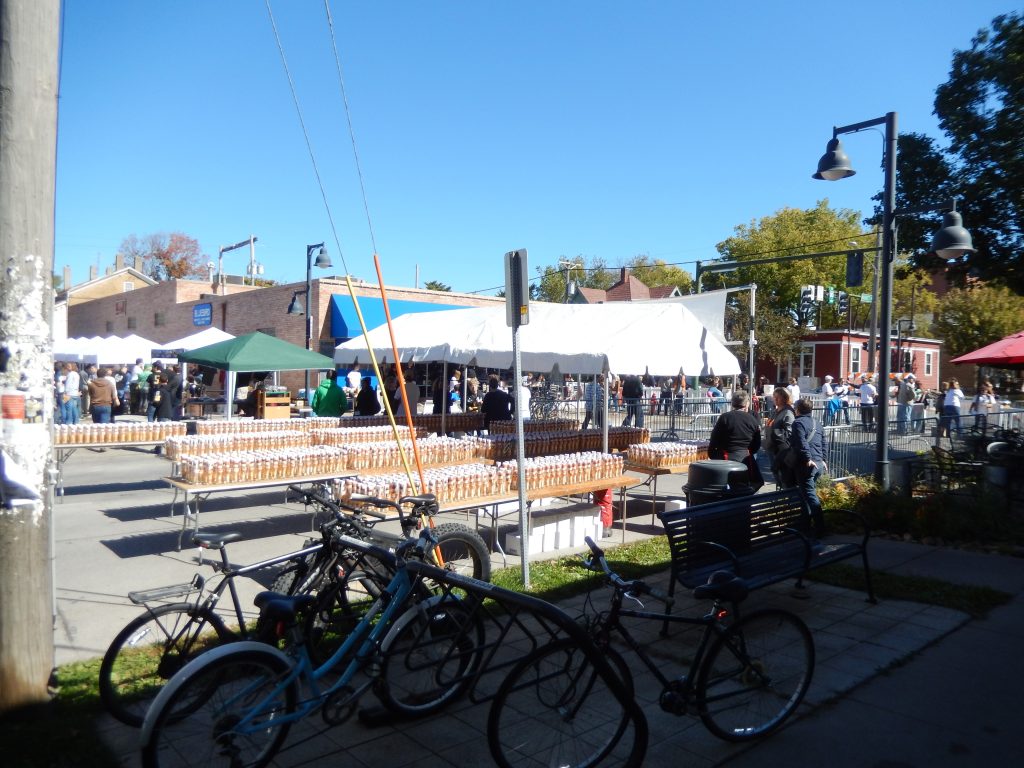 Tables setaup with cups at the 2015 Northside Oktoberfest in Downtown District of Iowa City