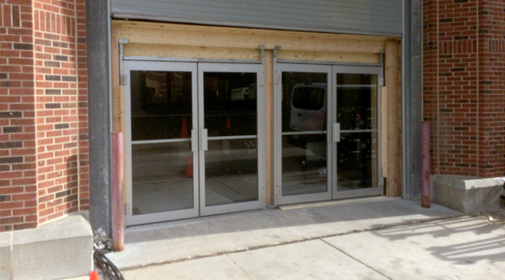 Adding double glass door fire exits to event hall to increase total capacity