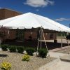30' x 45' Frame tent between building and a parking lot at Two Rivers Bank & Trust grand opening in Coralville, Iowa