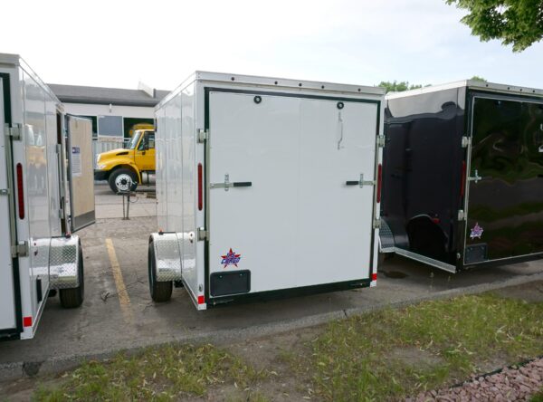 Back of White 6'x10' enclosed cargo trailer Vin Number 2803