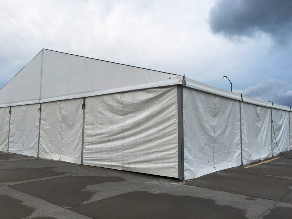 Corner of 60' x 98' Losberger tent with sidewalls setup for Ajinomoto North America Inc in Eddyville, Iowa