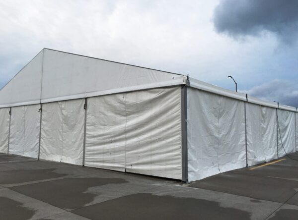 Corner of 60' x 98' Losberger tent with sidewalls setup for Ajinomoto North America Inc in Eddyville, Iowa