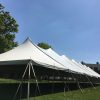 Outside of 40' x 160' rope and pole tent for a commencement ceremony at Grinnell College