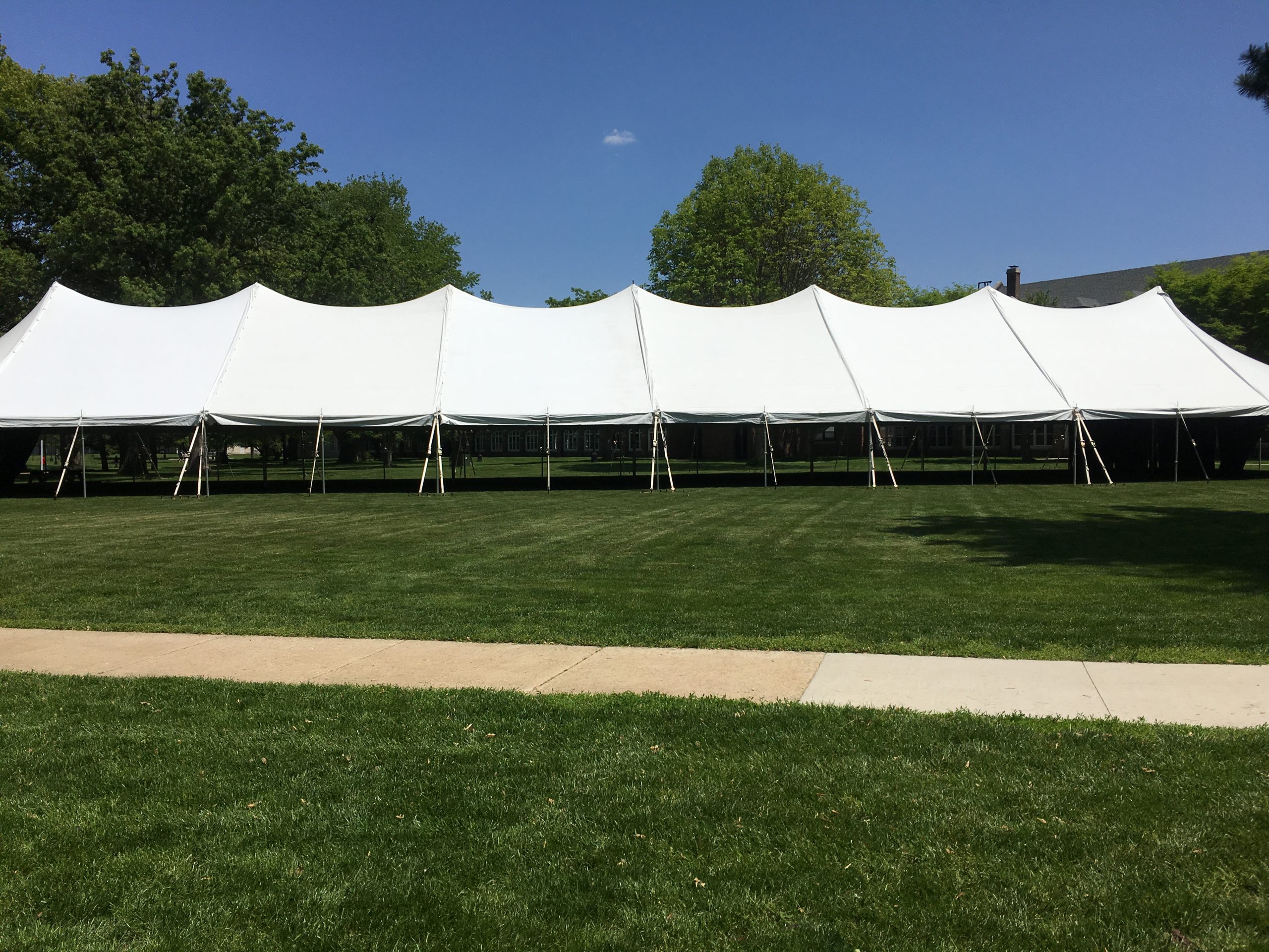 Side of the 40' x 160' rope and pole tent for commencement ceremony at Grinnell College 2016