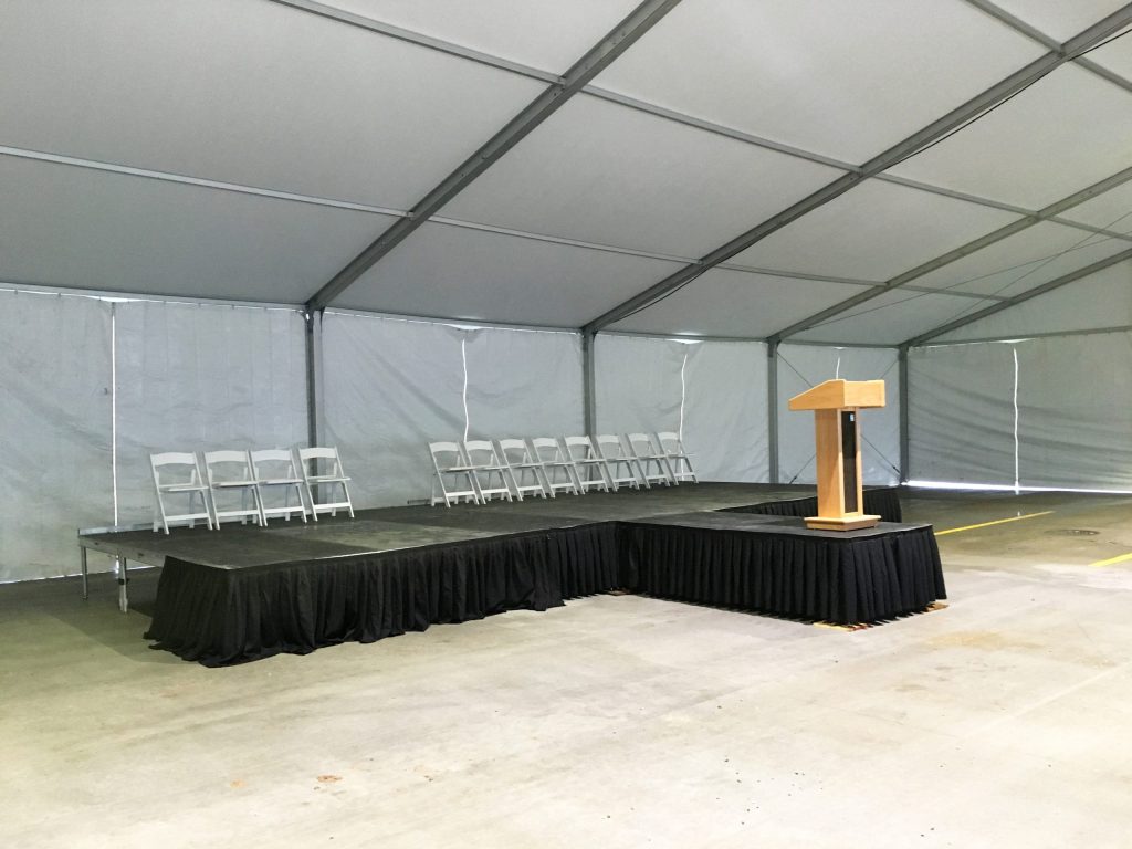 Stage setup under 60' x 98' Losberger tent setup for Ajinomoto North America Inc in Eddyville, Iowa
