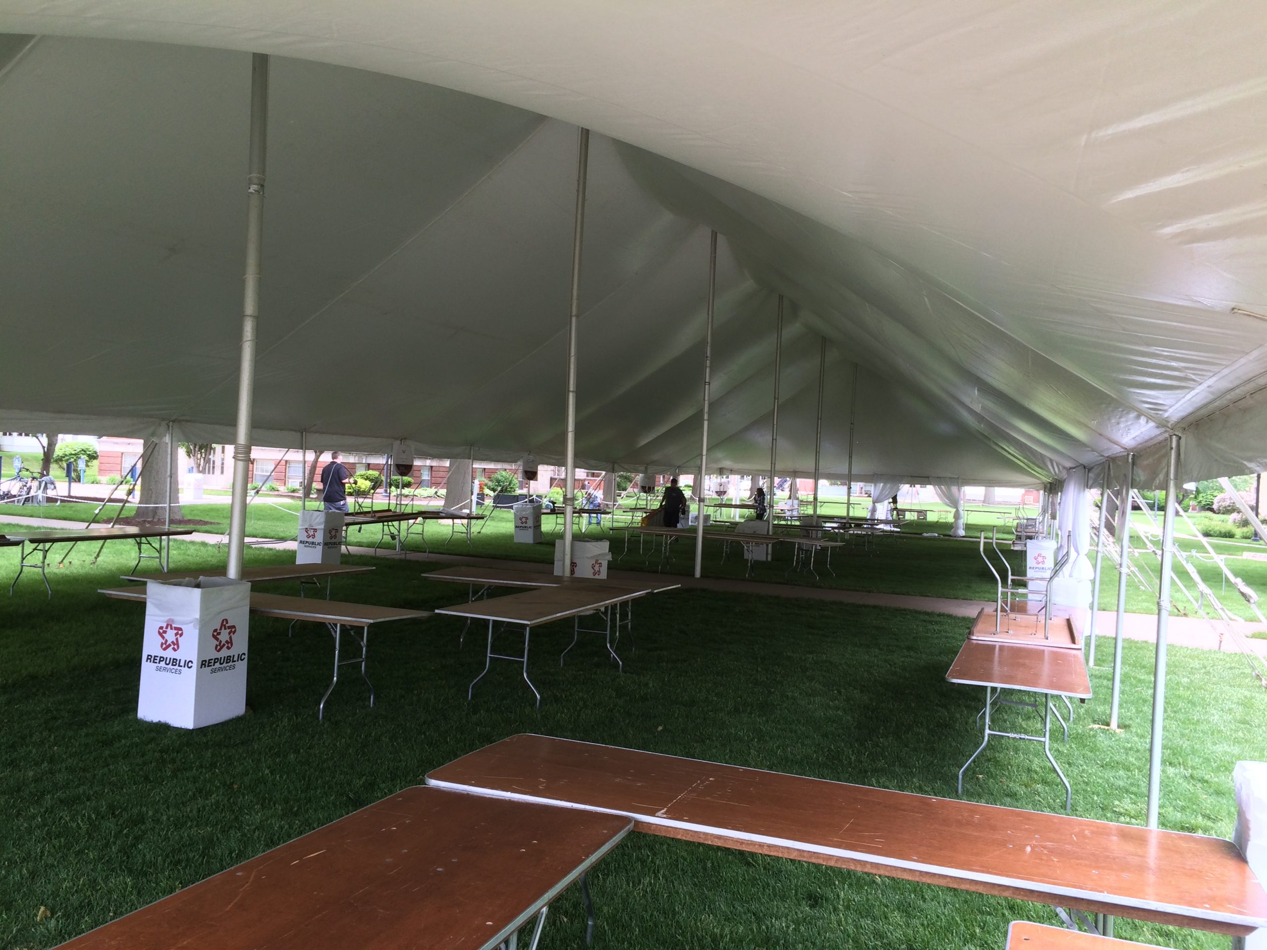 Under the 40' x 140' Rope and Pole tent in Davenport, IA, for a Wine Festival/Wine Tasting event.