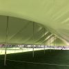 Under a 40' x 160' rope and pole tent for the commencement ceremony at Grinnell College 2016