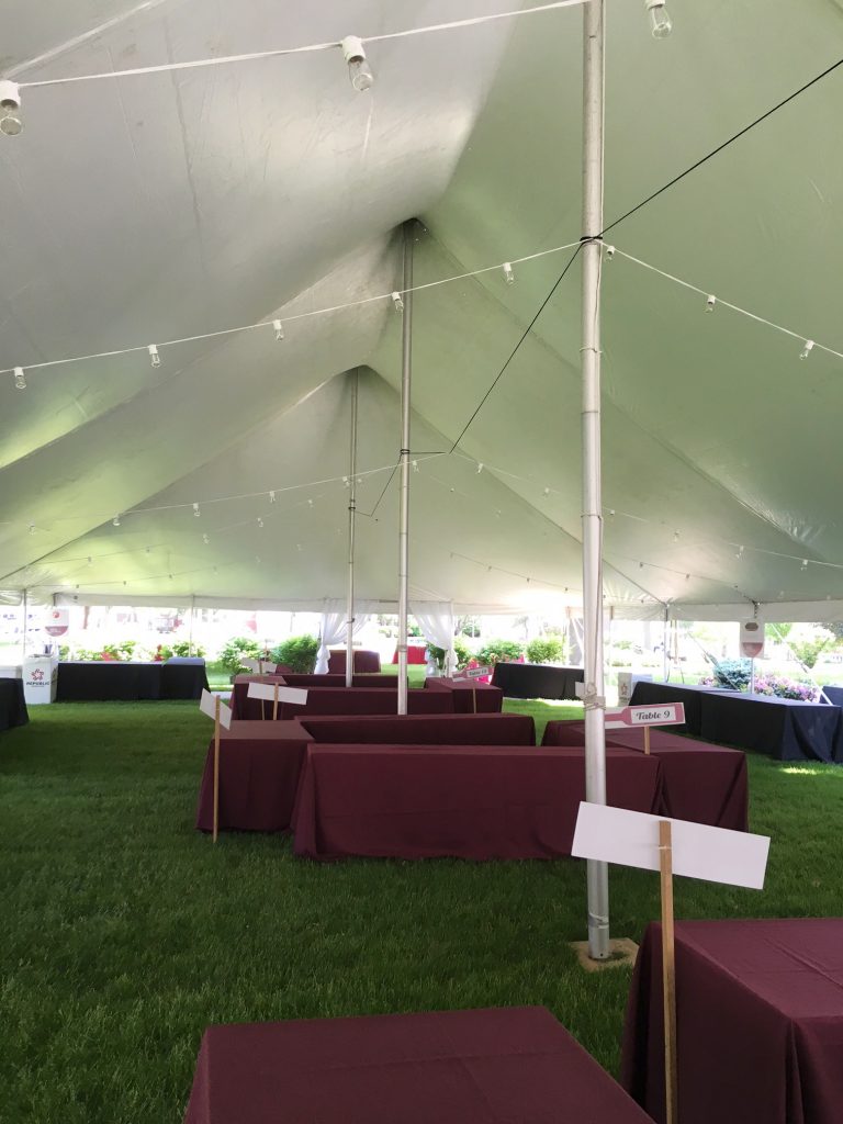 Under the 40' x 140' Rope and Pole tent in Davenport, IA for a Wine Festival Wine Tasting event.