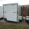 White 6'x10' enclosed cargo trailer Vin Number 2803 back with side door open
