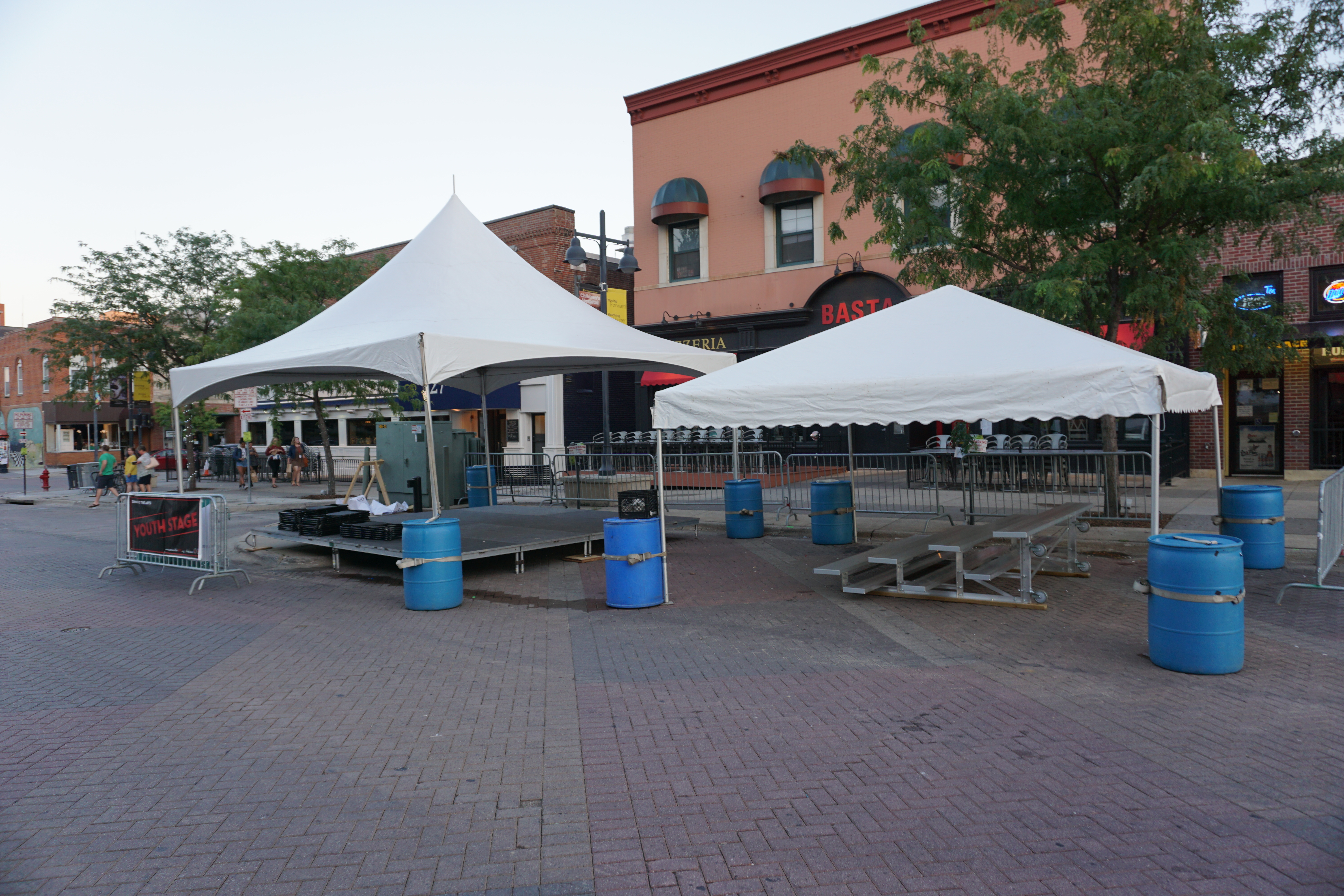 20'x20' Tentology and 20'x20' frame tent setup for the youth stage at Jazz Festival in Iowa City, IA
