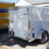 Back right of 5' x 8' white single axle enclosed trailer for rent or sale sn2643