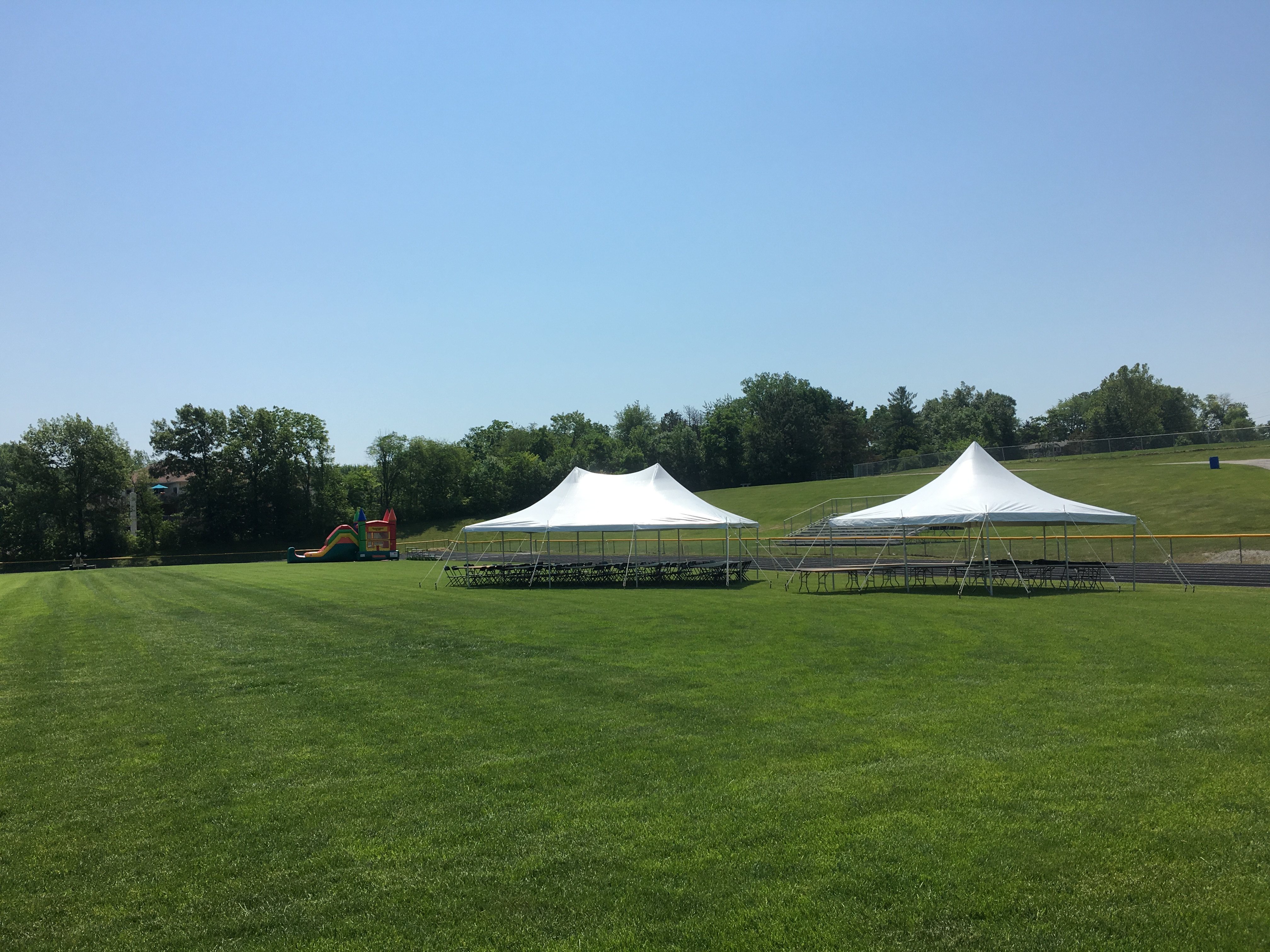 Bounce house (left), 20'x30' rope and pole tent (middle) and 20'x20' rope and pole tent (right)