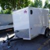 Left side of 5' x 8' white single axle enclosed trailer for rent or sale sn2643